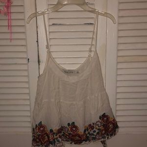 White tank top with lace and flowers on bottom